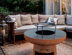 Barbecue rond avec plaque ronde en acier et grille en acier corten